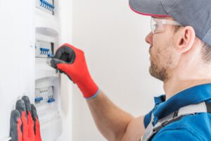 Electric Residential Fuses Box Check by Caucasian Electrician.